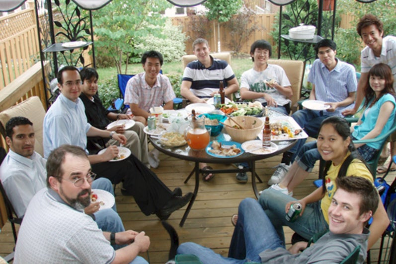 PCL BBQ @ Kaan’s house Cambridge, July 2007. People sitting around a table.