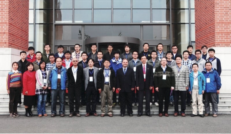 International Workshop on Mathematics and Algorithms for Computer-Aided Manufacturing, MAMENC, Oct 2014. People standing.