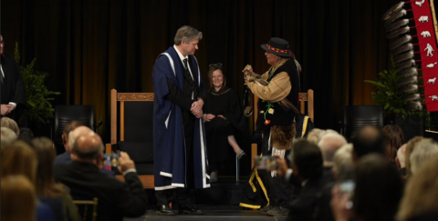 President Bill recieving a pendant from Indigenous elder Myeengun Henry