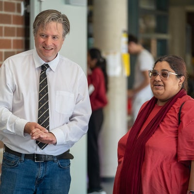 Bill chatting with a lady