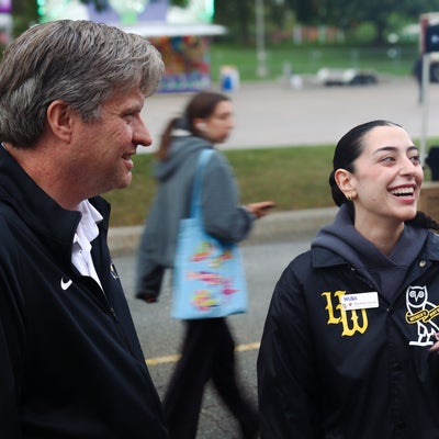 Bill and a student laughing