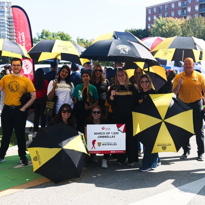 President Rosehart with the University of Waterloo group attending the United Way March of 1,000 Umbrellas
