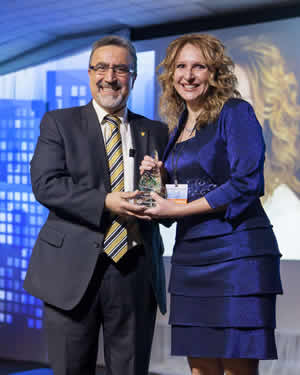 Feridun Hamdullahpur presents the Greater KW Chamber of Commerce Young Entrepreneur of the Year Award to Lesley Warren, owner of Lesley Warren Design Group, at the 2015 Business Excellence Awards Gala on Friday, February 20.