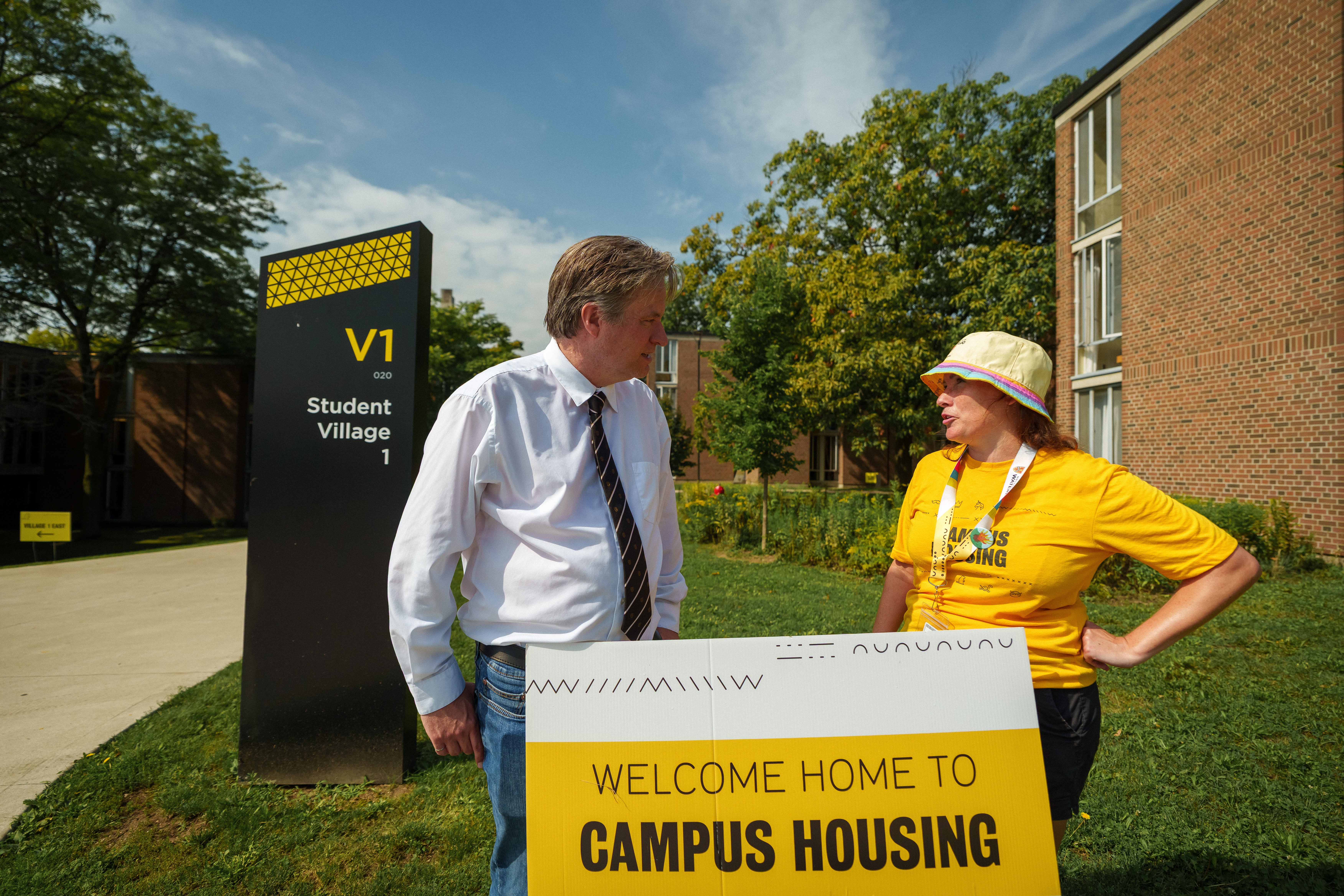 Bill talking to a move-in day staff member 