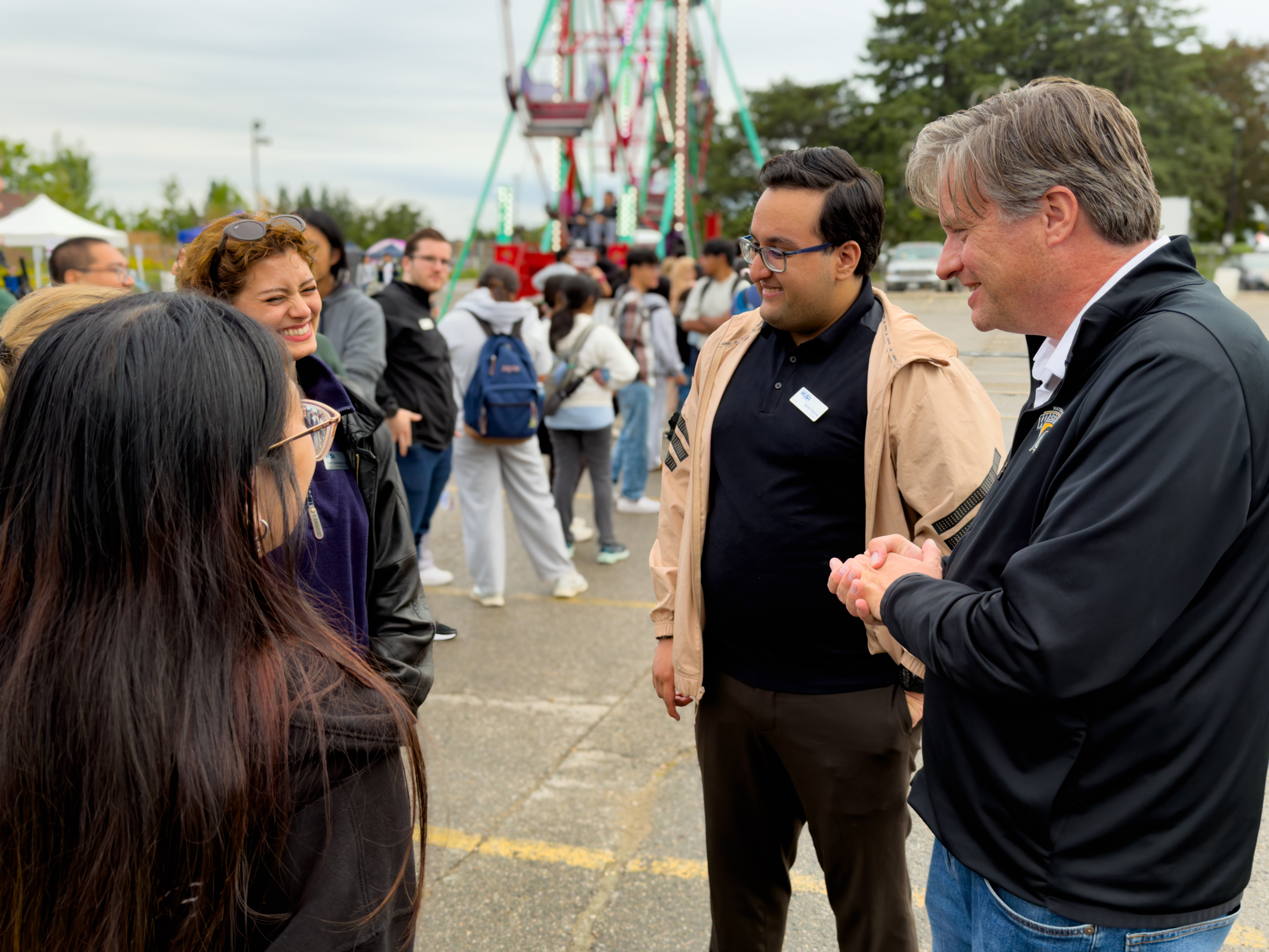 President Rosehart talking to students at the WUSA Carnival