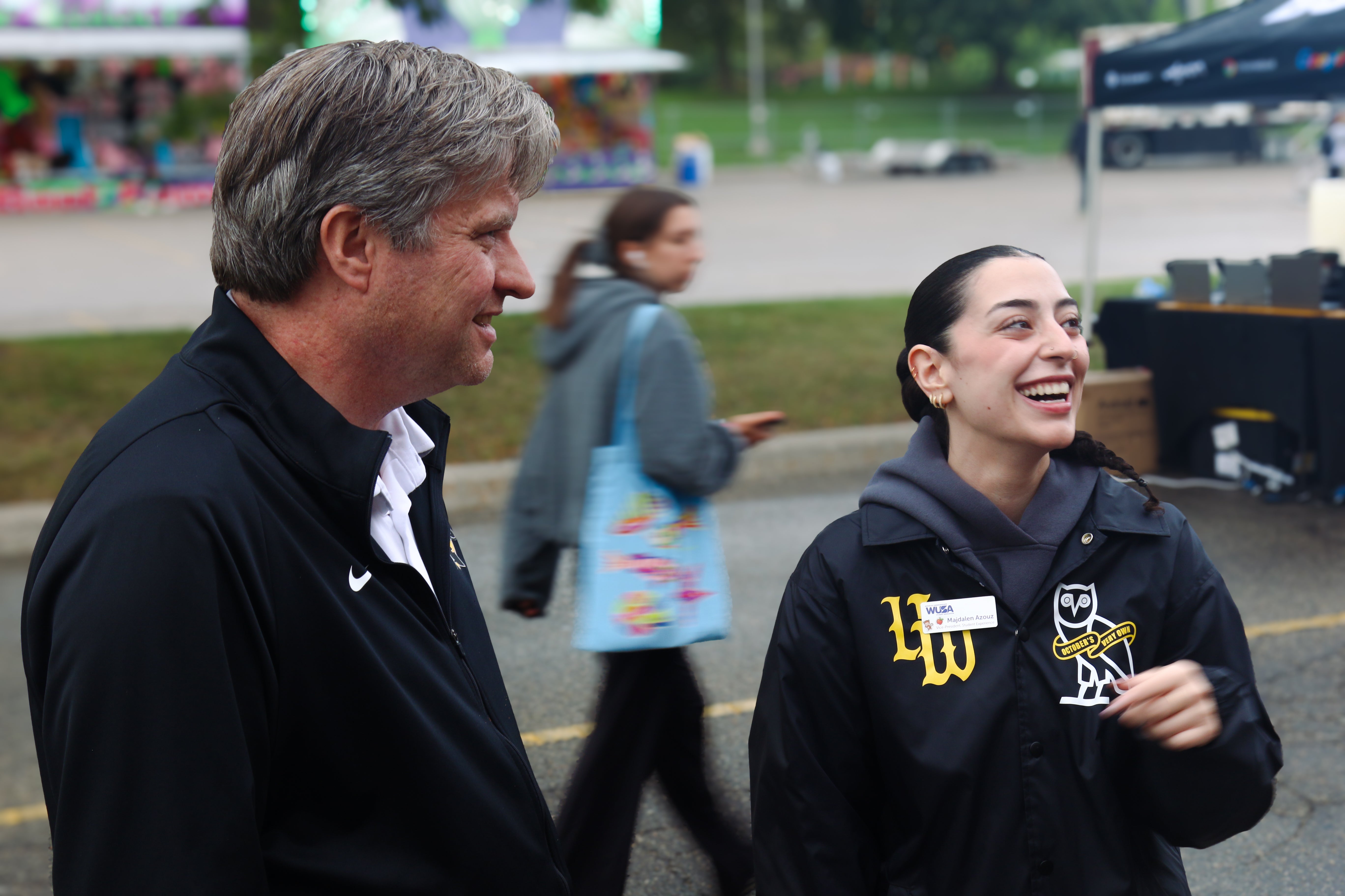 Bill and a student laughing