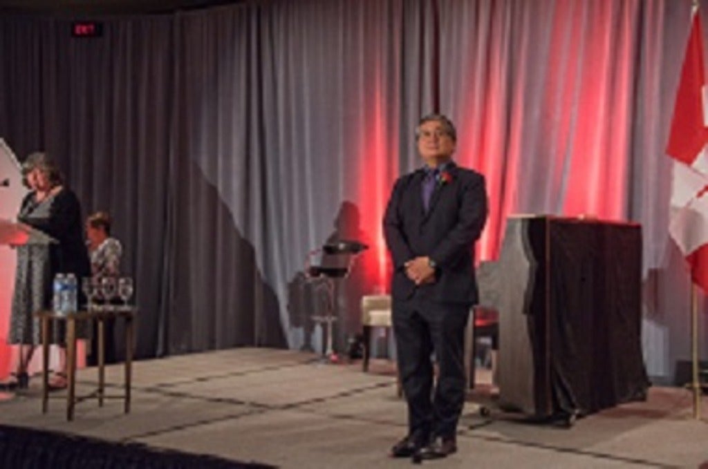 Geoff Fong on stage being inducted to the Royal Society of Canada