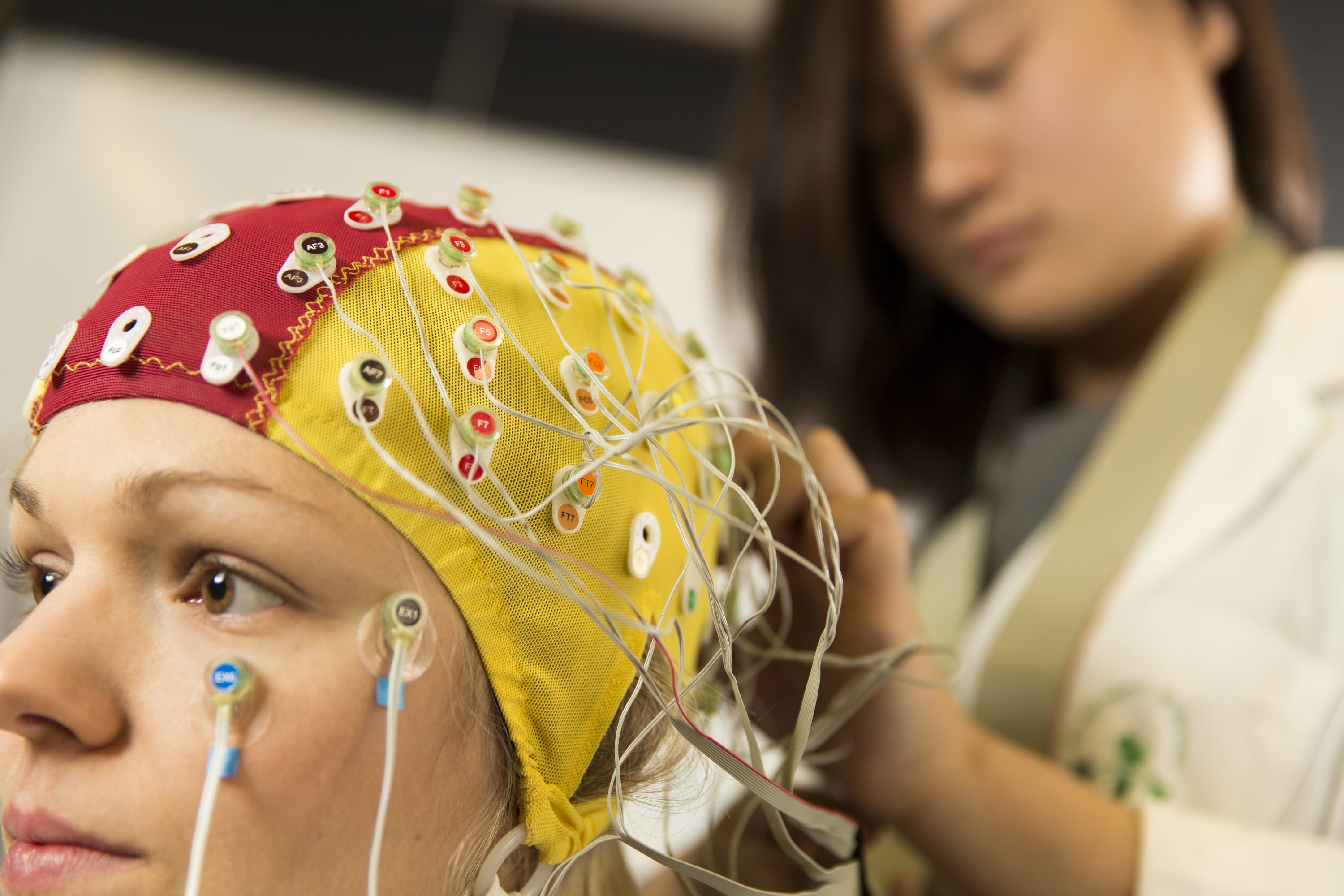 Subject fitted with a Electroencephalogram (EEG) cap to see the fine details of when brain activity occurs.