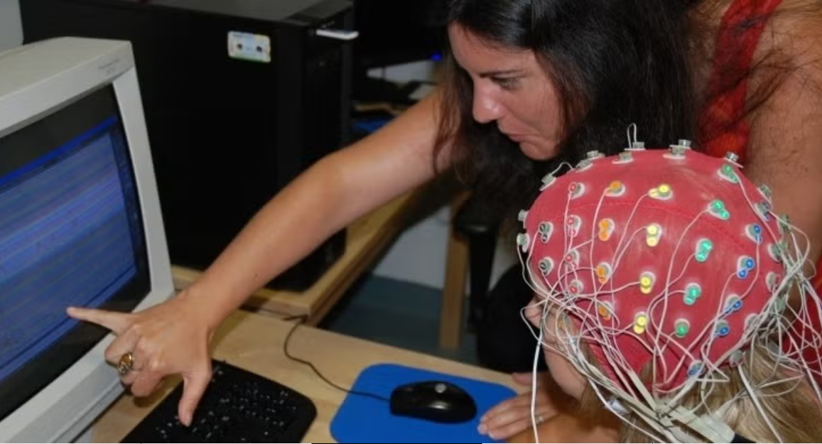 Participant reading EEG scan
