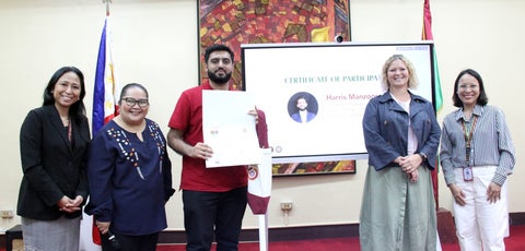 Harris Manzoor with team and mentors at case evaluation competition.