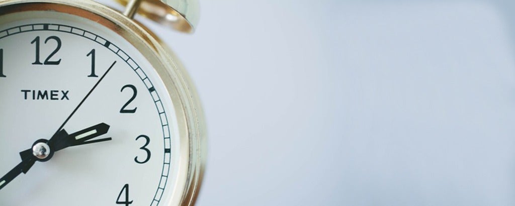 Ticking clock symbolizing return to work.