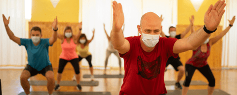 People in an exercise class with face masks on