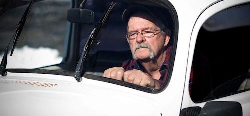 Older man driving  a car