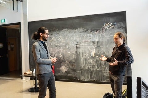 Lukas Chrostowski of Dream Photonics (left) with graduate student Parham Pashaei (right).