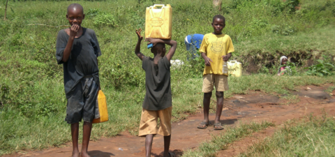 Kids in Africa carrying water