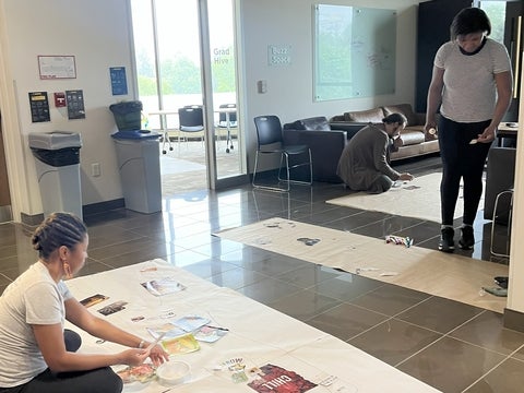 A student placing down images for their body map.