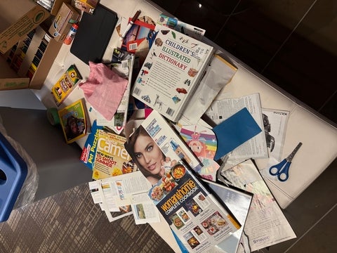 Collage materials spread out on a surface.