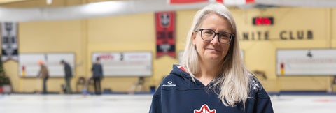 Dr. Heather Mair at curling rink.