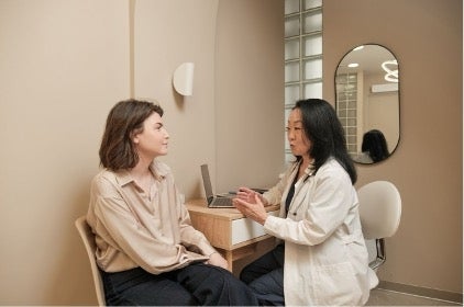 A medical professional having a conversation with a patient