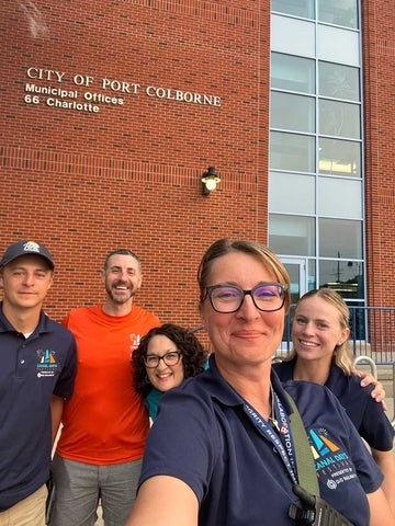 Kennedy and Port Colborne colleagues selfie in front of city office.