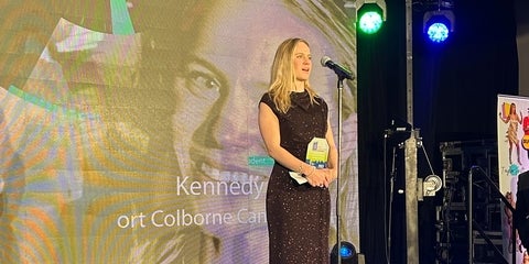 Kennedy onstage accepting Festival and Events Ontario award.