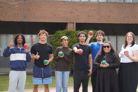Students stand together after playing Bocce.