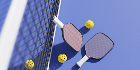 Pickleball paddles, balls and a net