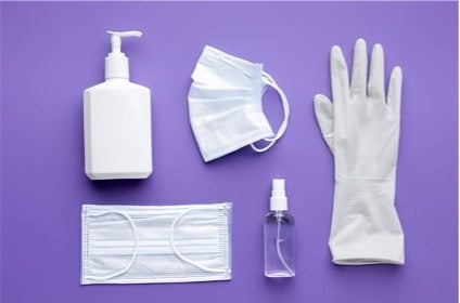 mask, glove, and other personal protective equipment on a purple background