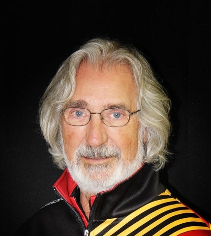 Man with grey hair and glasses.