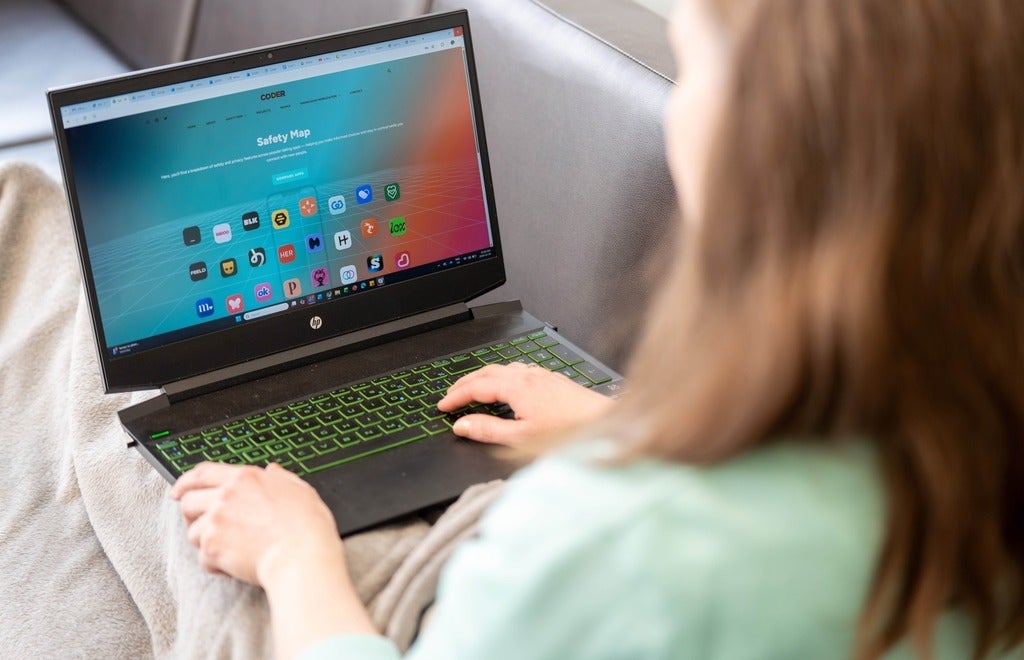 A user views the Safety Map app and a laptop.