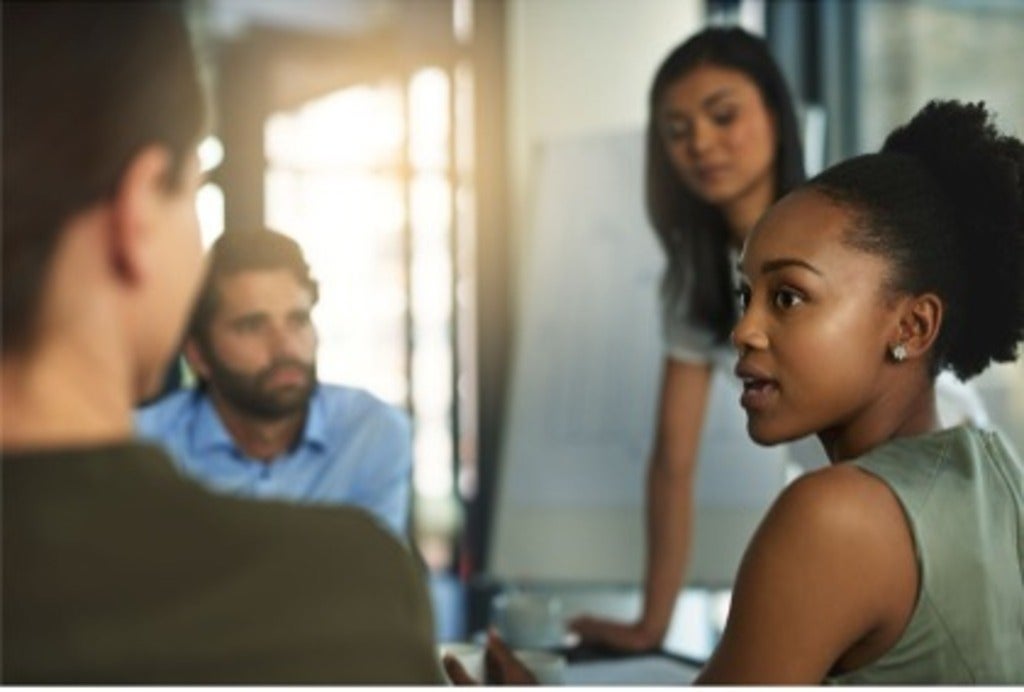 A group of people in a meeting