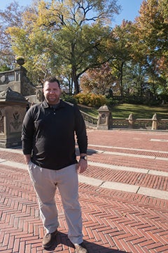 Dylan Flannery standing on brick path at Central Park, New York City