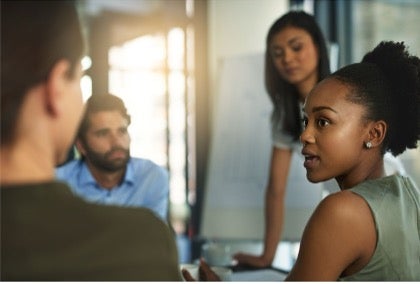 A group of people in a meeting