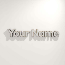 &quot;Your Name&quot; letters in front of beige background.