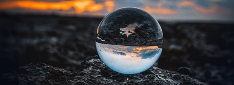 A sphere agains a stormy background - link to Religion and Politics