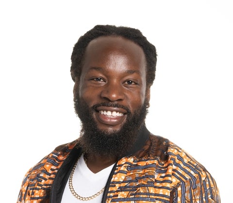 Christopher Stuart Taylor wearing an orange patterned jacket