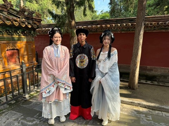 three people in traditional dress