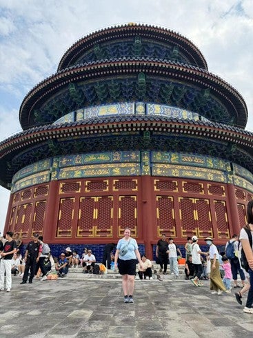 person in front of traditional building