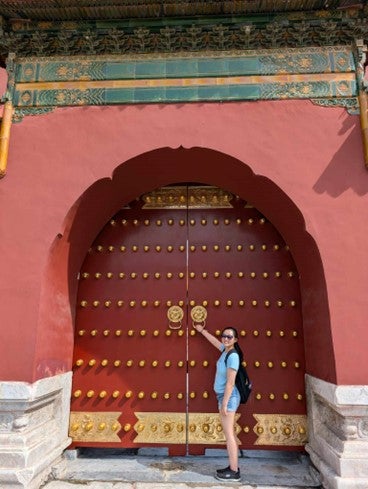 person at an an arched doorway