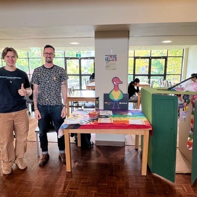 Student smiling at a booth.