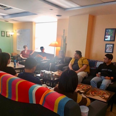 a group of students sitting in the link inclusion lounge