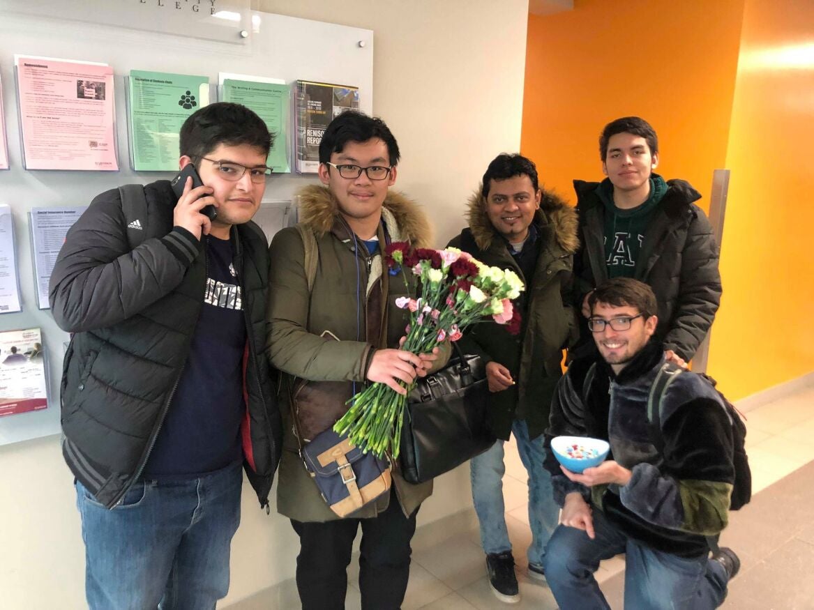 Students handing out flowers