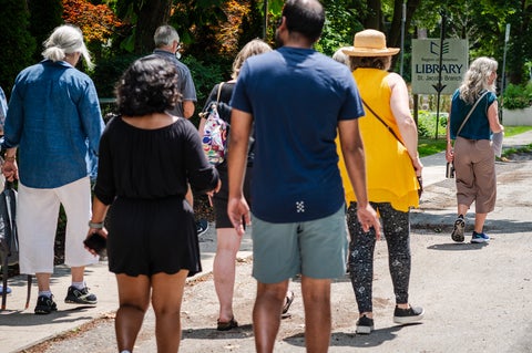 Juanita Metzger walking in front of a tour group
