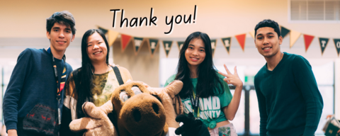 Four students standing with Reni Moose. A handwritten "thank you" is overlayed. 