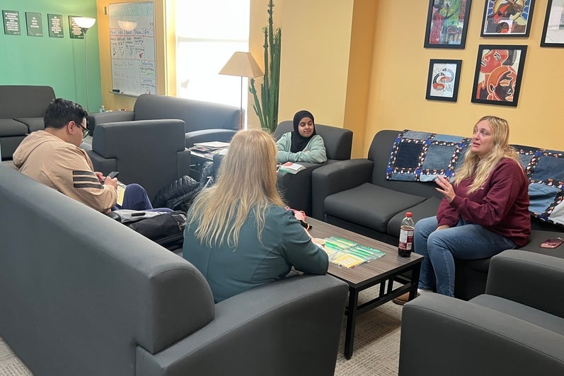 Four people sitting in a lounge