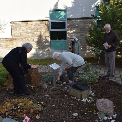 People putting stones in the Bryant Stone Garden