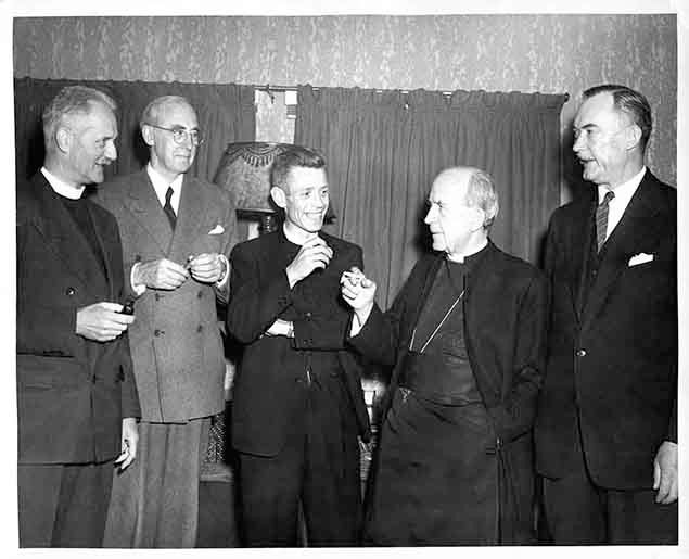 Archbishop Renison surrounded by clergy and others