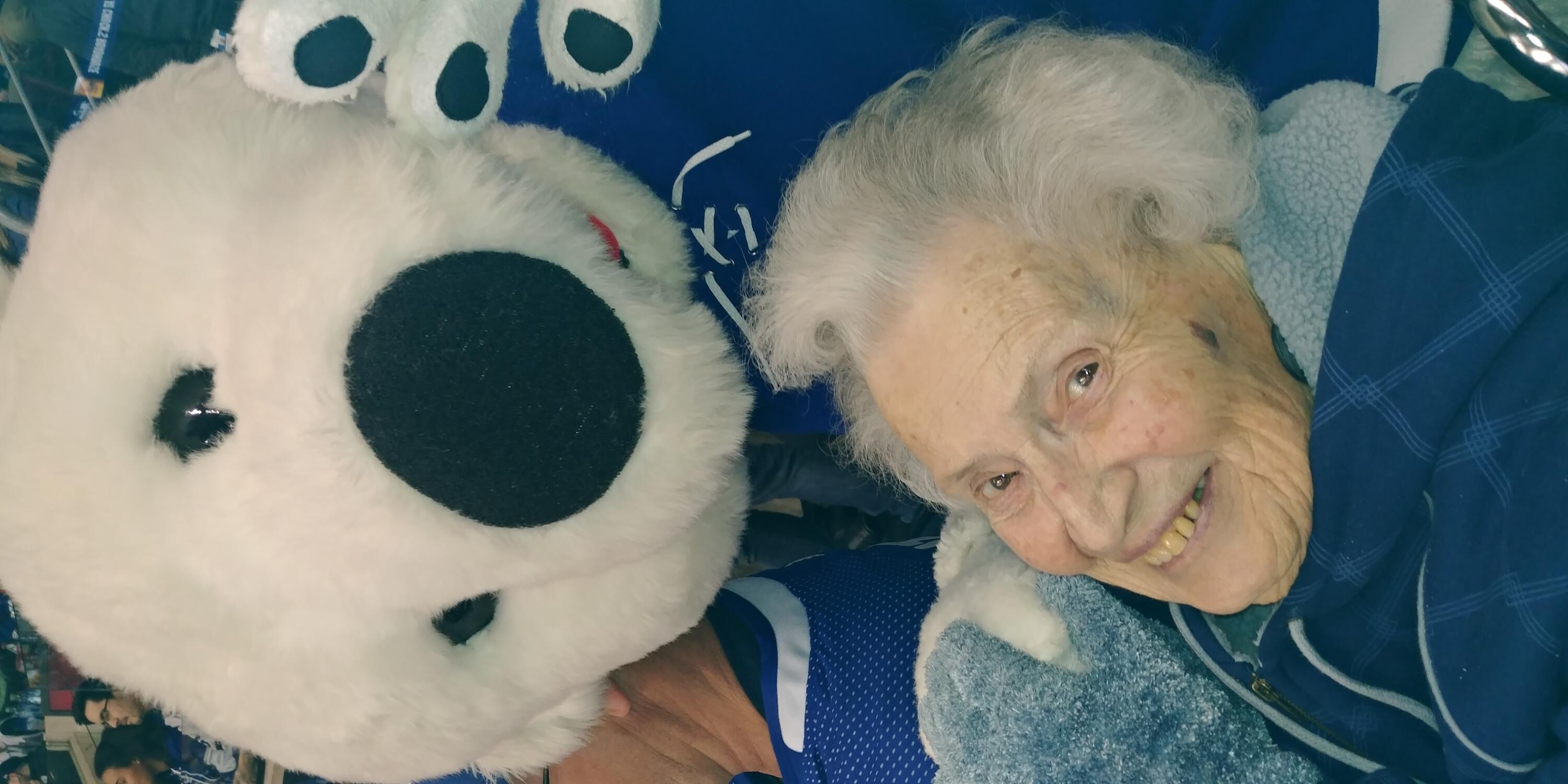 Joy with the mascot of the Toronto Maple Leafs.