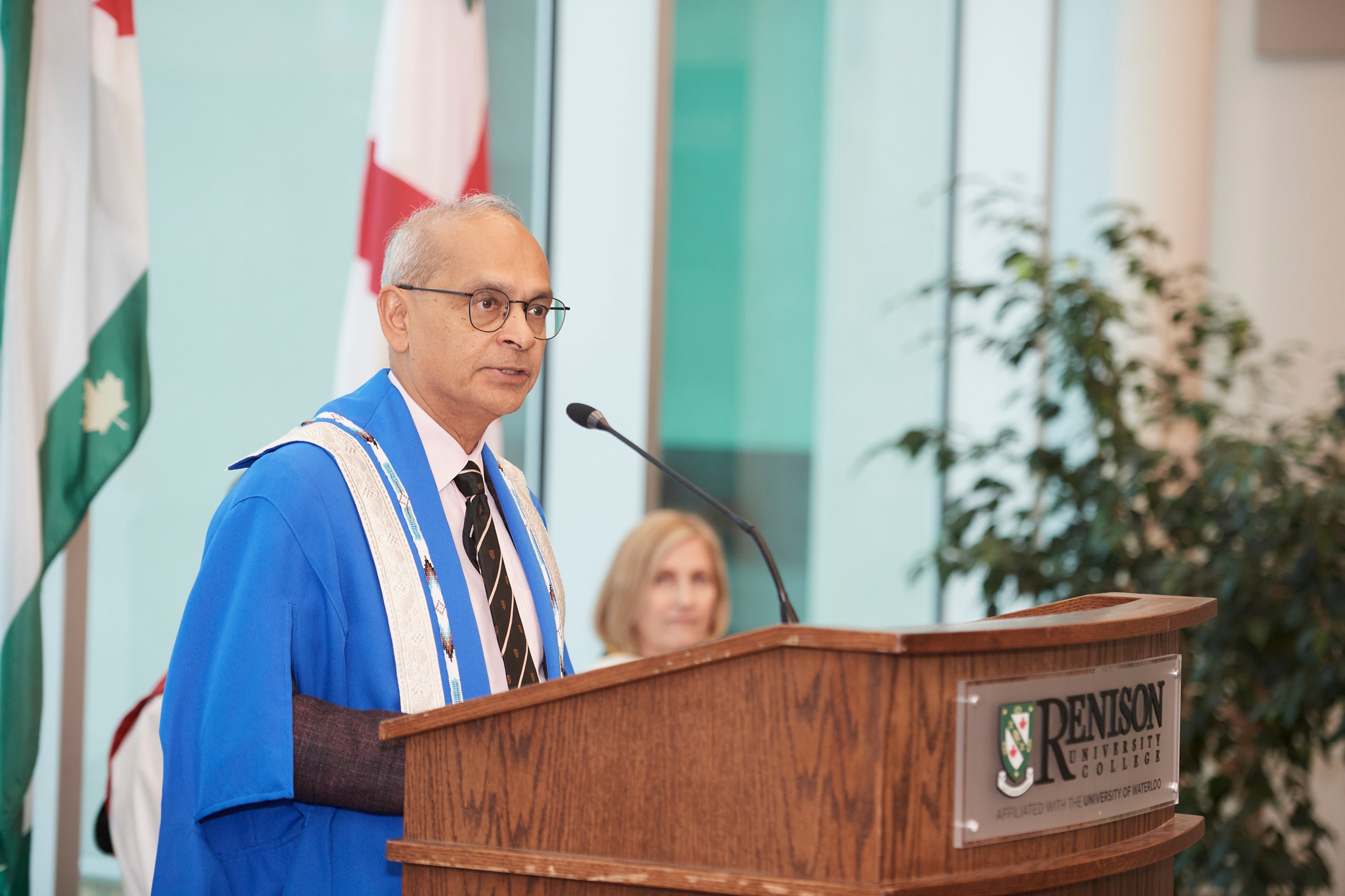 Vivek Goel stands at the podium during his address. 