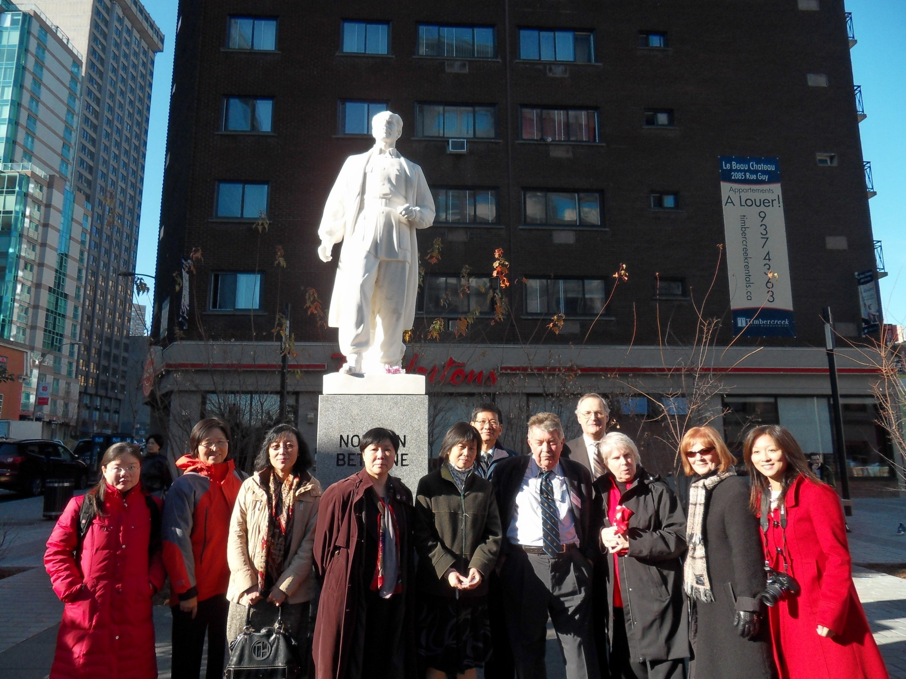 Yan Li and others in front of Norman Bethune Statue in Montreal